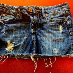 Distressed jean mini skirt